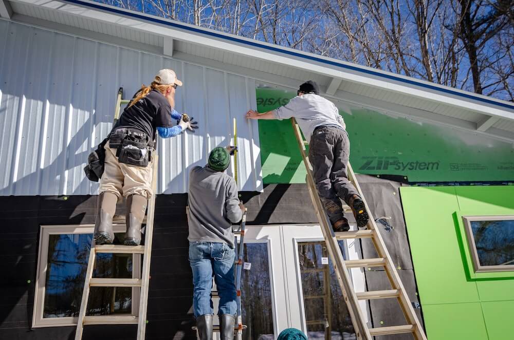 installing siding of home