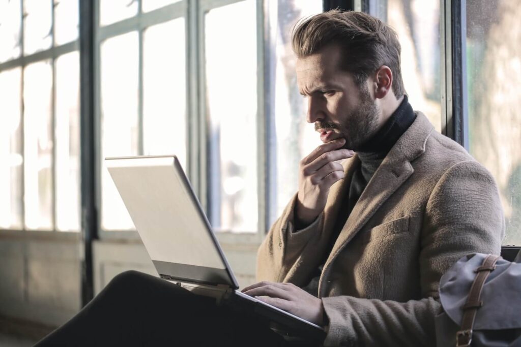 man on laptop confused