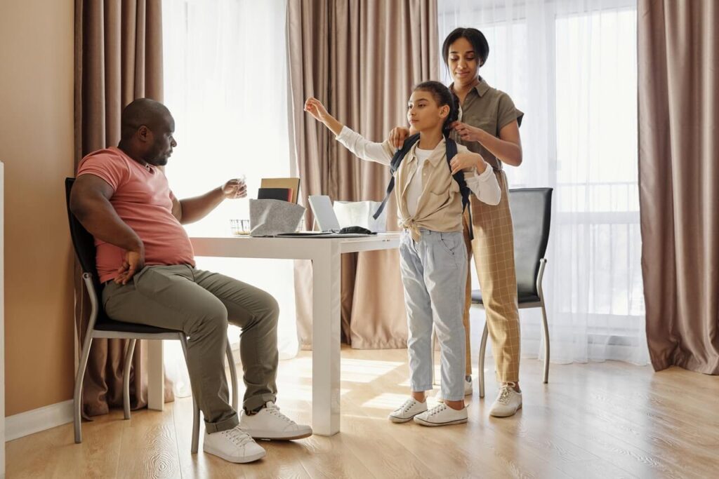 Family getting their kid ready for school